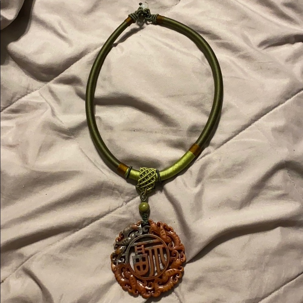 Nephrite jade hand carved pendant and so cord